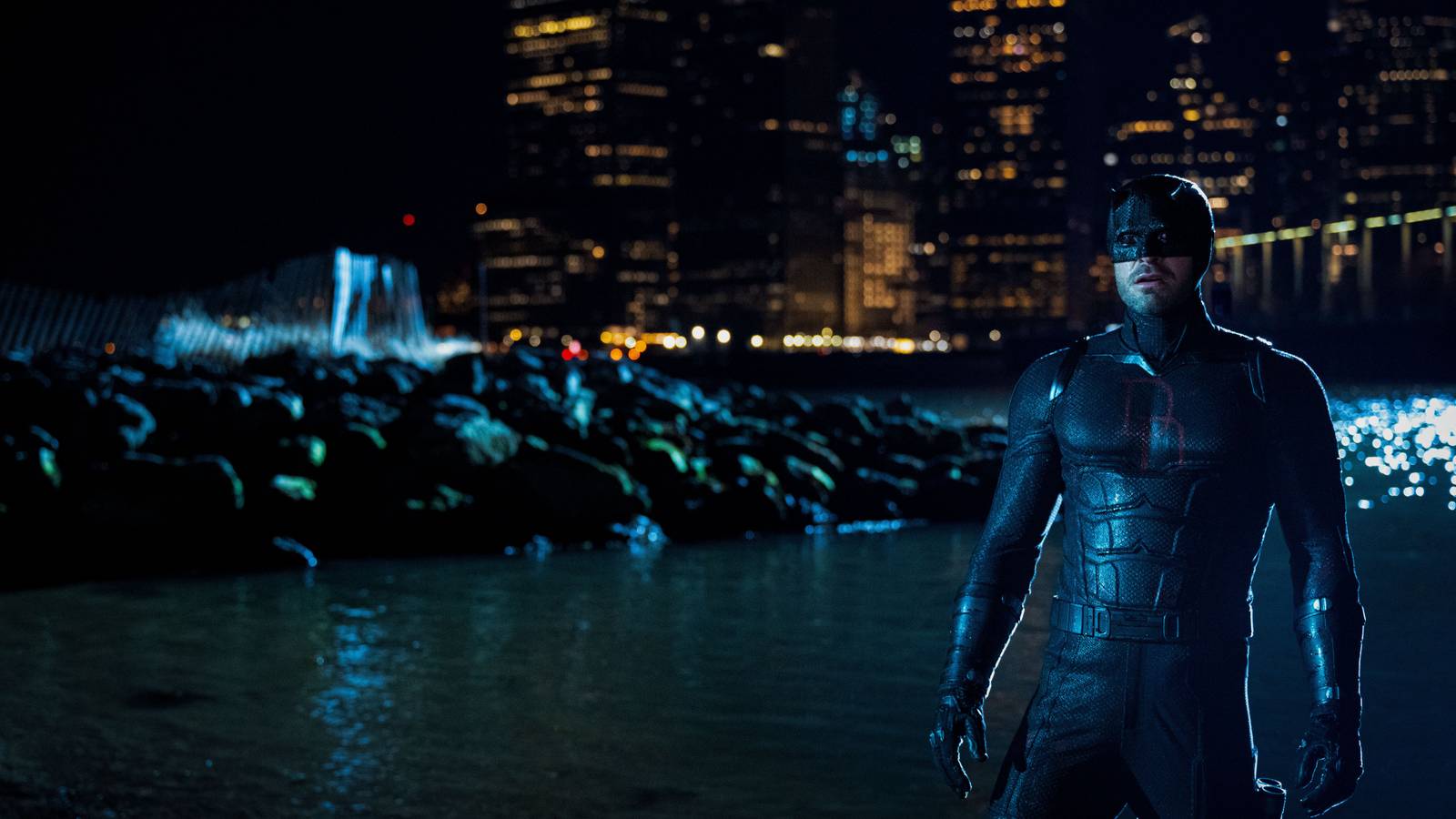 Charlie Cox as Daredevil in Daredevil_ Born Again standing by the water in New York City