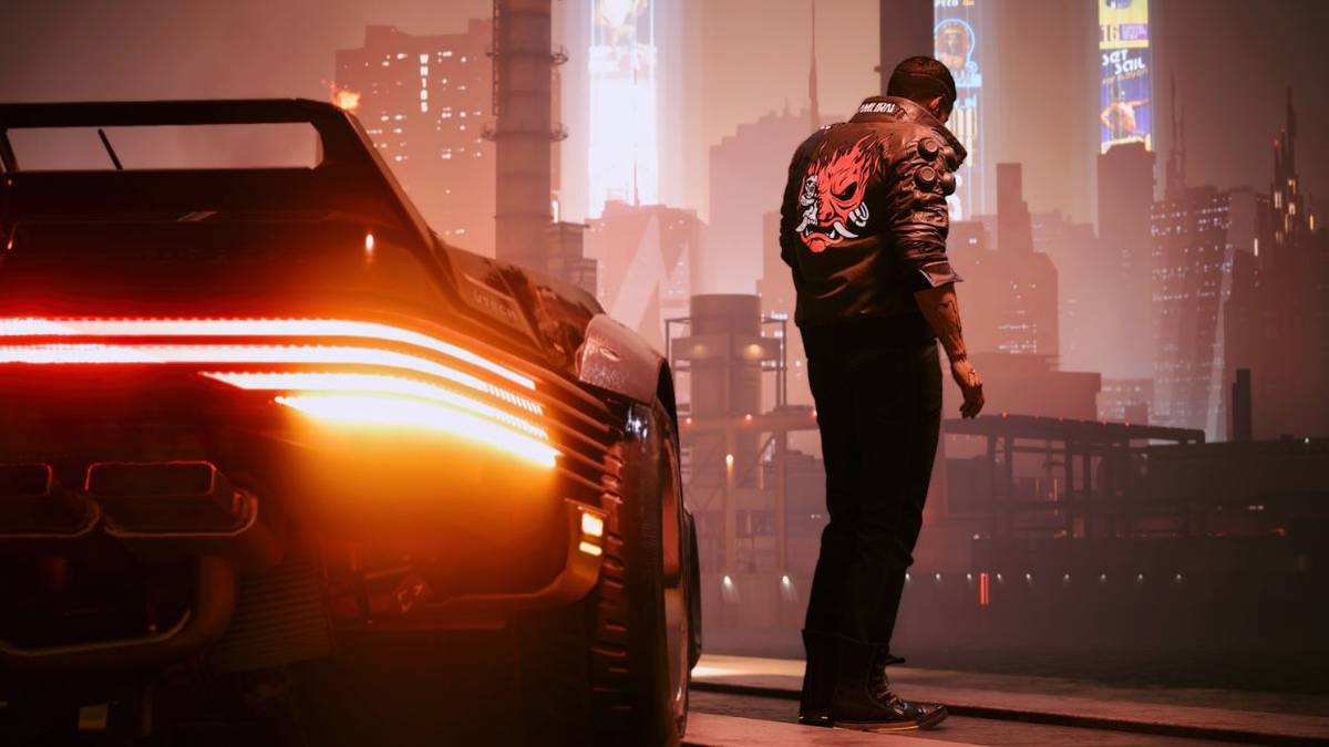 V in Cyberpunk 2077 standing alongside his car while Night City stretches out before him.