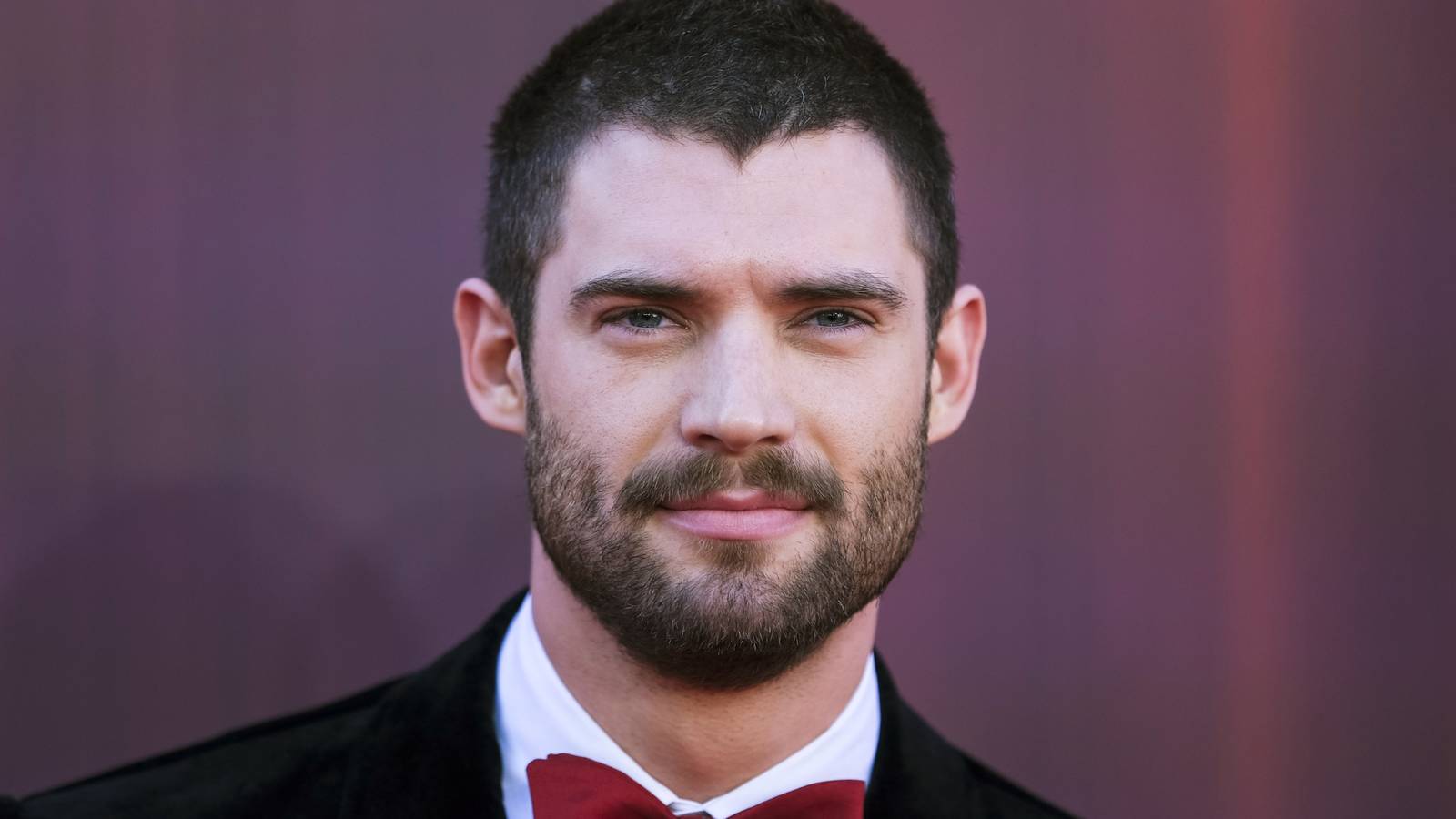 David Corenswet posing on a red carpet
