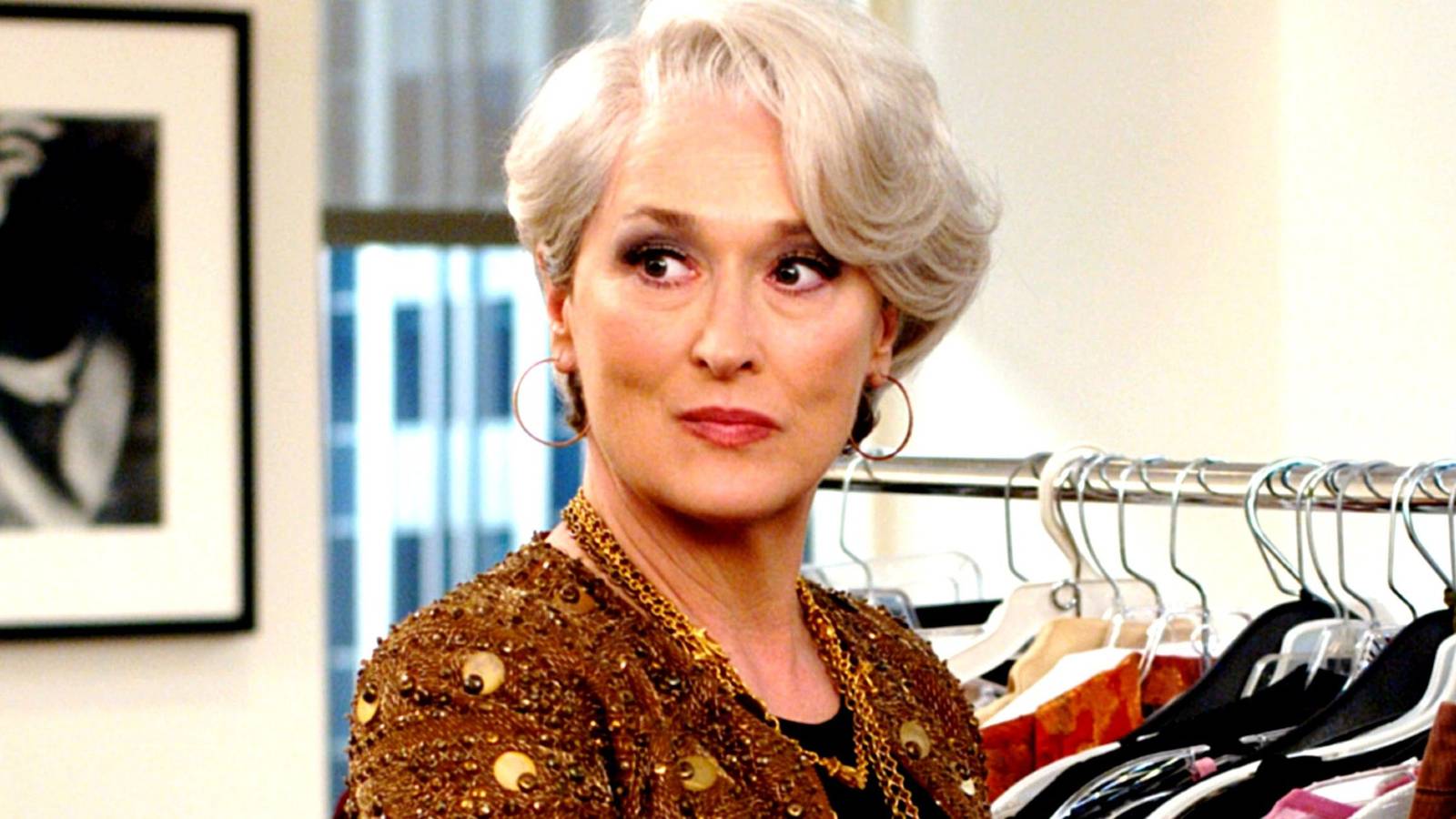Miranda looking to the side with pursed lips in The Devil Wears Prada
