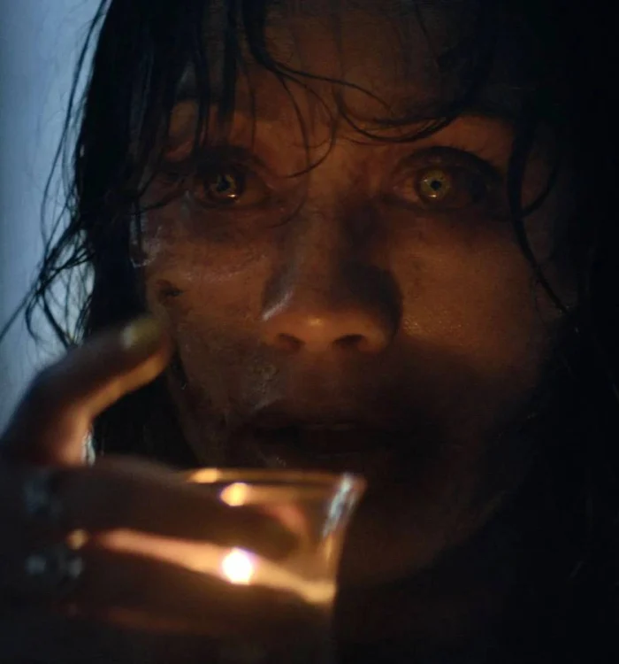 A Deadite From Evil Dead Burn Preparing To Drink Candle Wax