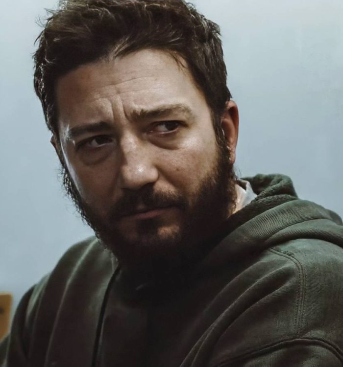 John Magaro looking deeply sad in Omaha