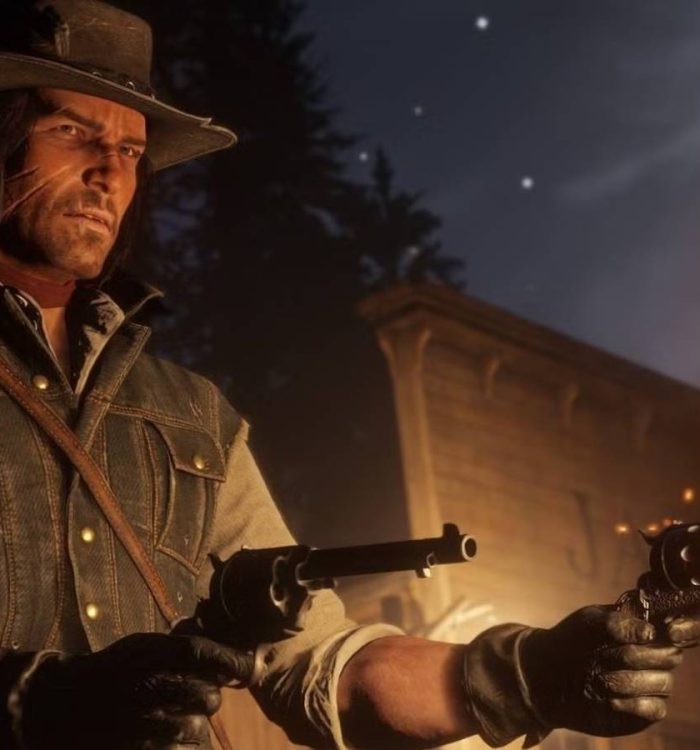 John Marston holds two pistols and fires one of them at night in Red Dead Redemption 2.