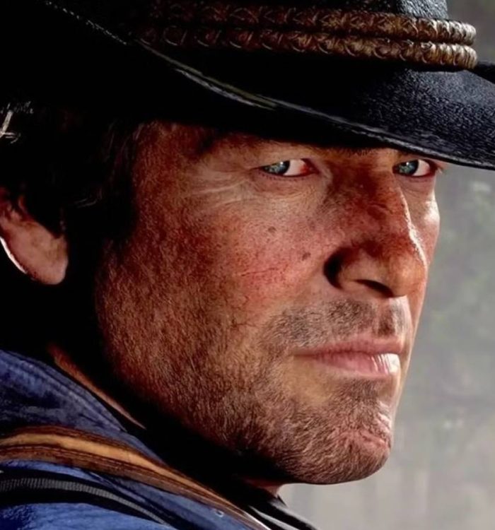 red dead redemption 2's arthur morgan looks towards the camera