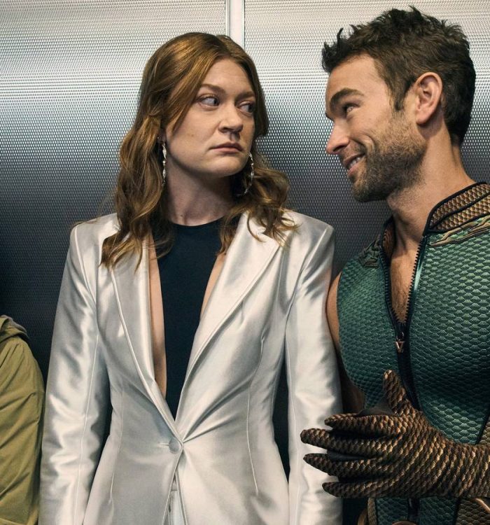 The Deep and Ashley looking at each other inside an elevator while Sister Sage stands beside them...