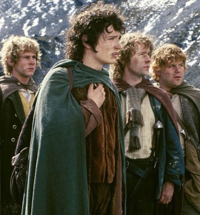 The four hobbits by a mountain in The Lord of the Rings