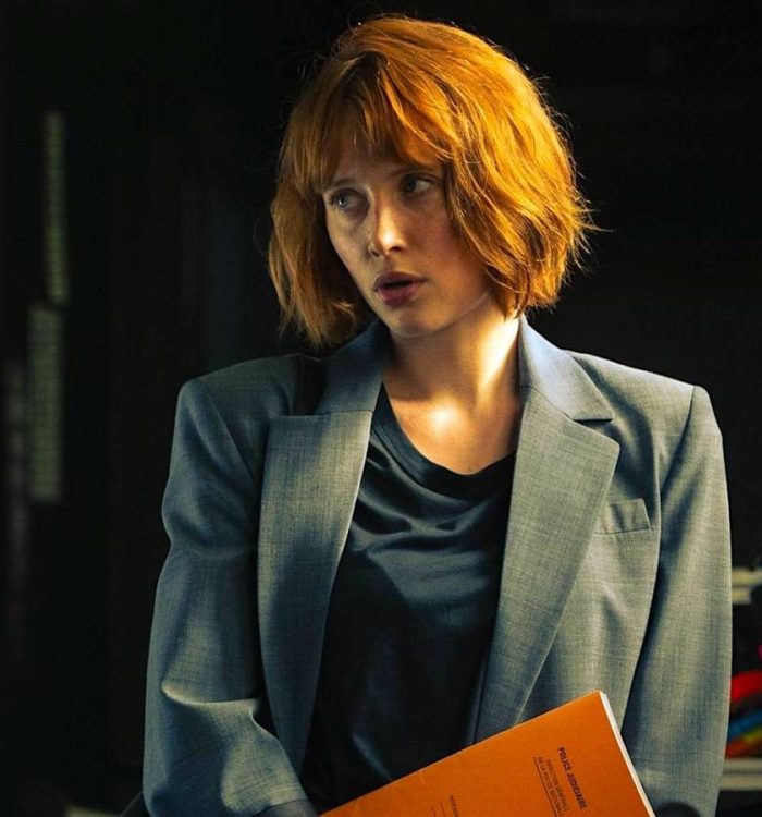 A woman with an orange bob in Netflix's Under a Dark Sun.